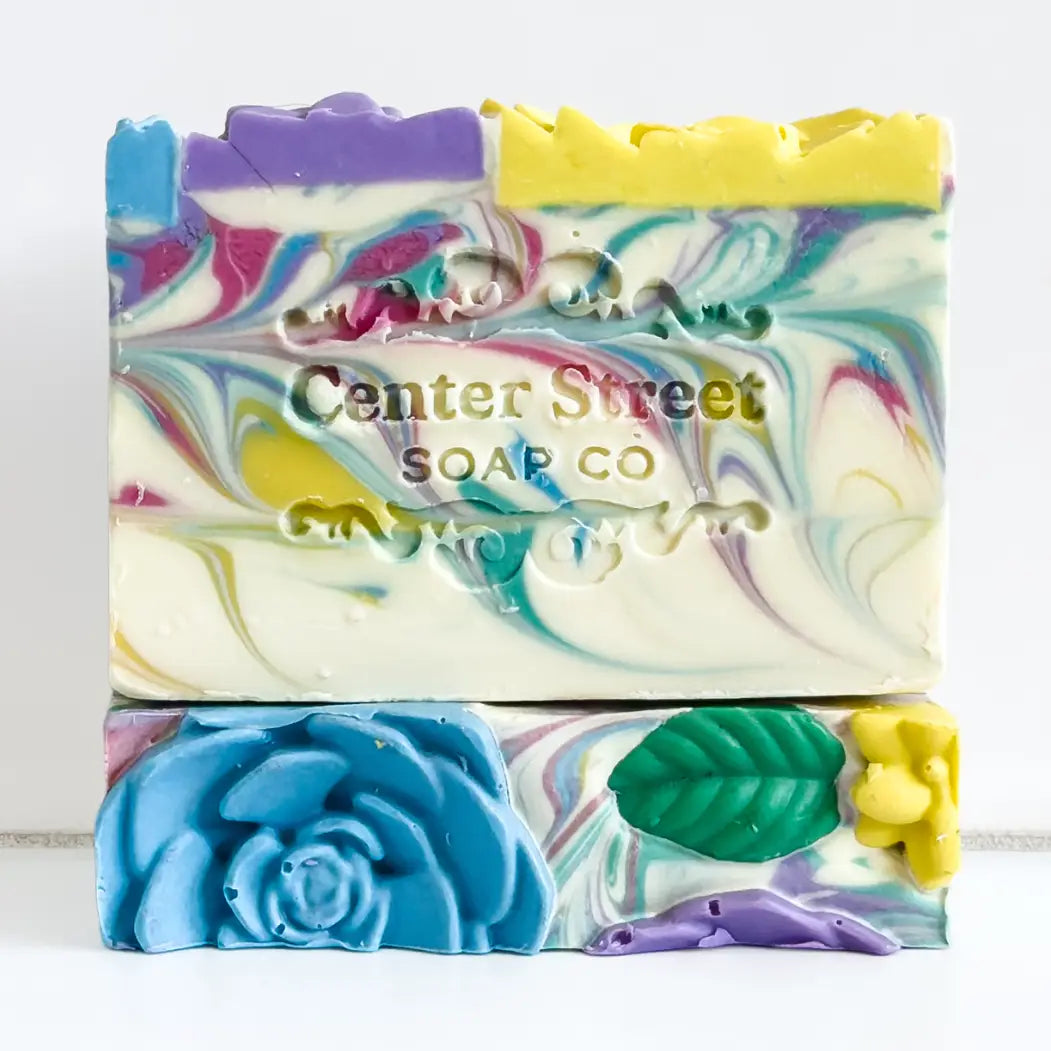 Colorful soap bar with floral designs and 'Center Street Soap Co' branding on a white background