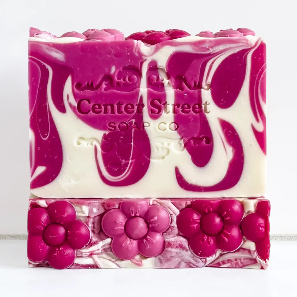 Pink and white soap bar with floral designs and 'Center Street Soap Co' branding on a white background