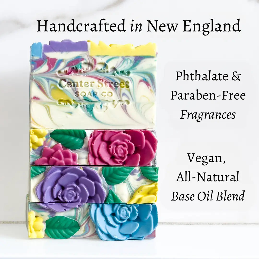 Colorful soap bars with floral designs and 'Center Street Soap Co' branding on a white background.