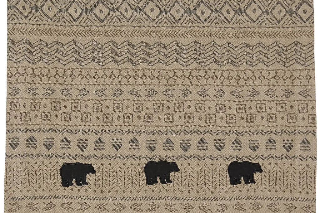 Beige patterned placemat with black bear illustrations on a white background