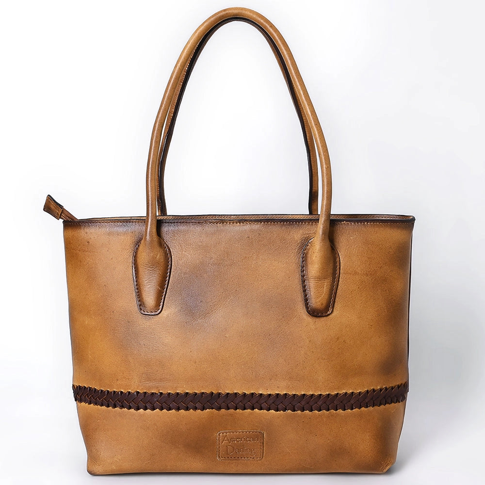 Brown leather tote bag with braided detail on a white background
