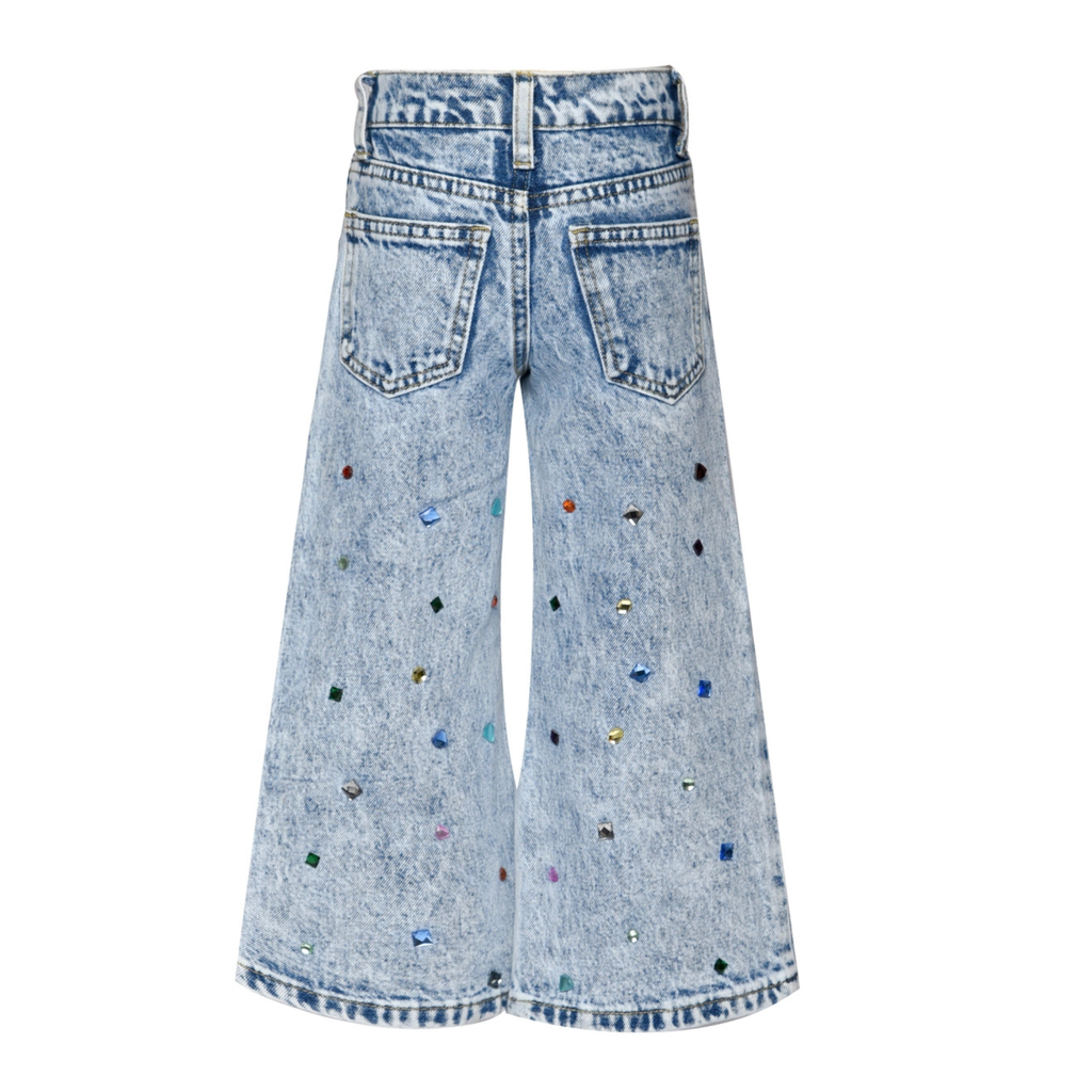 Light blue jeans with colorful embellishments on a white background