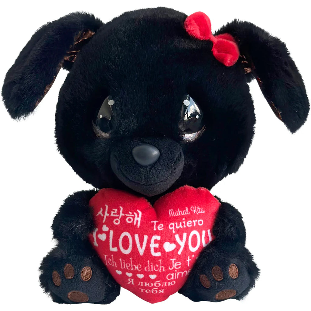Black plush dog with a red heart and bow, holding a heart-shaped 'I love you' pillow on a white background.