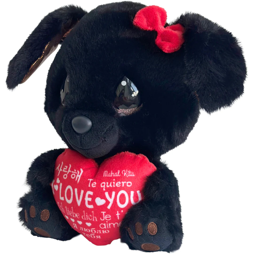 Black plush dog with a red heart and bow, holding a red heart pillow with 'Love You' text.