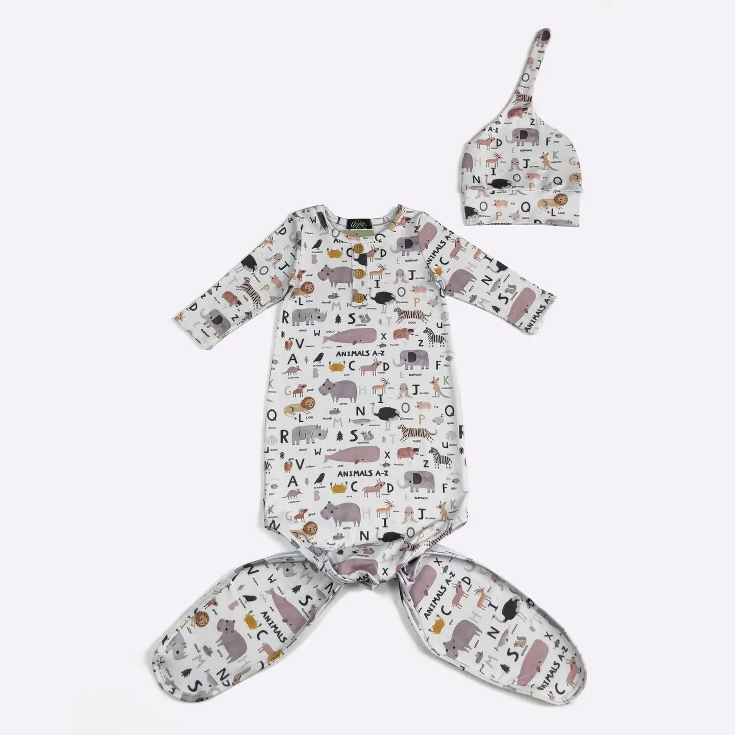 Baby onesie and hat set with animal pattern on a white background