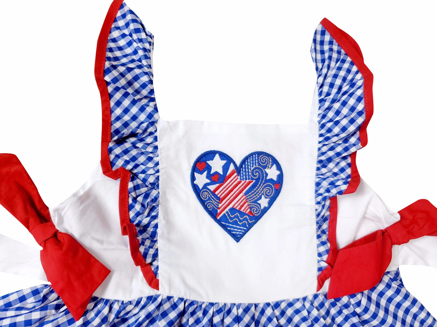 Children's outfit with red, white, and blue checkered design and heart-shaped American flag graphic.
