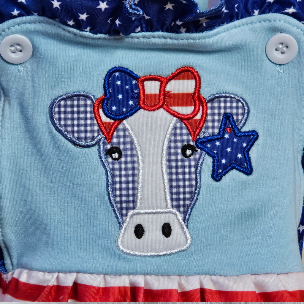 Cow design with American flag elements on a blue background