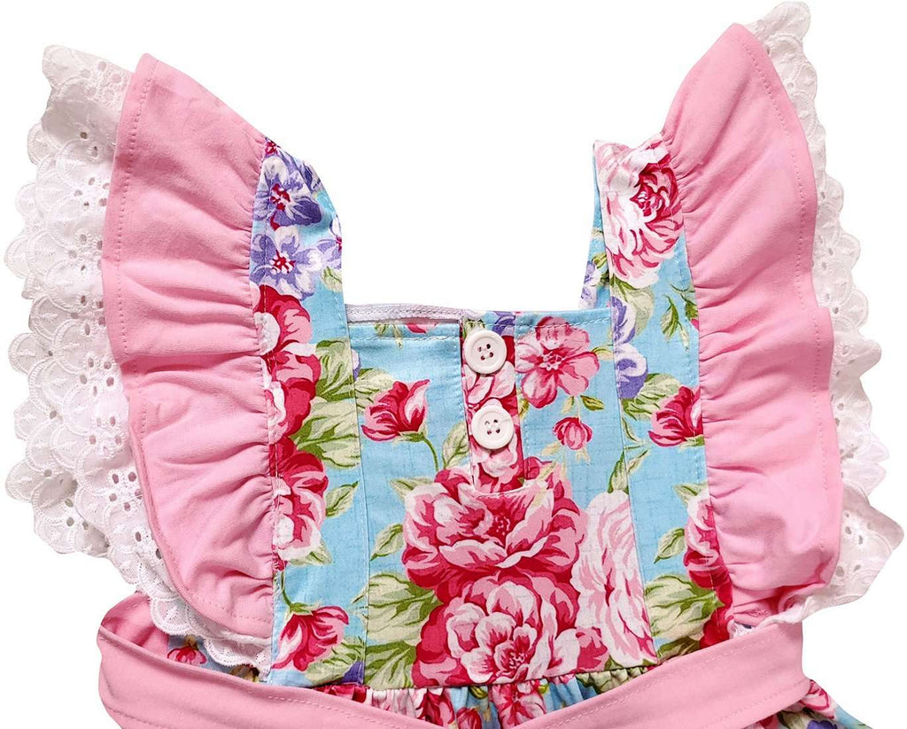 Floral patterned bag with pink ruffles on a white background