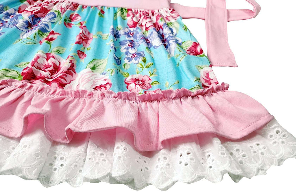 Floral dress with pink and white ruffled hem on a white background