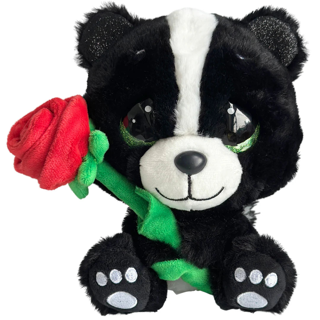 Plush toy skunk holding a red rose on a white background