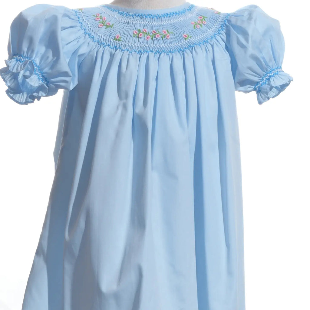 Light blue dress with embroidered neckline on a white background