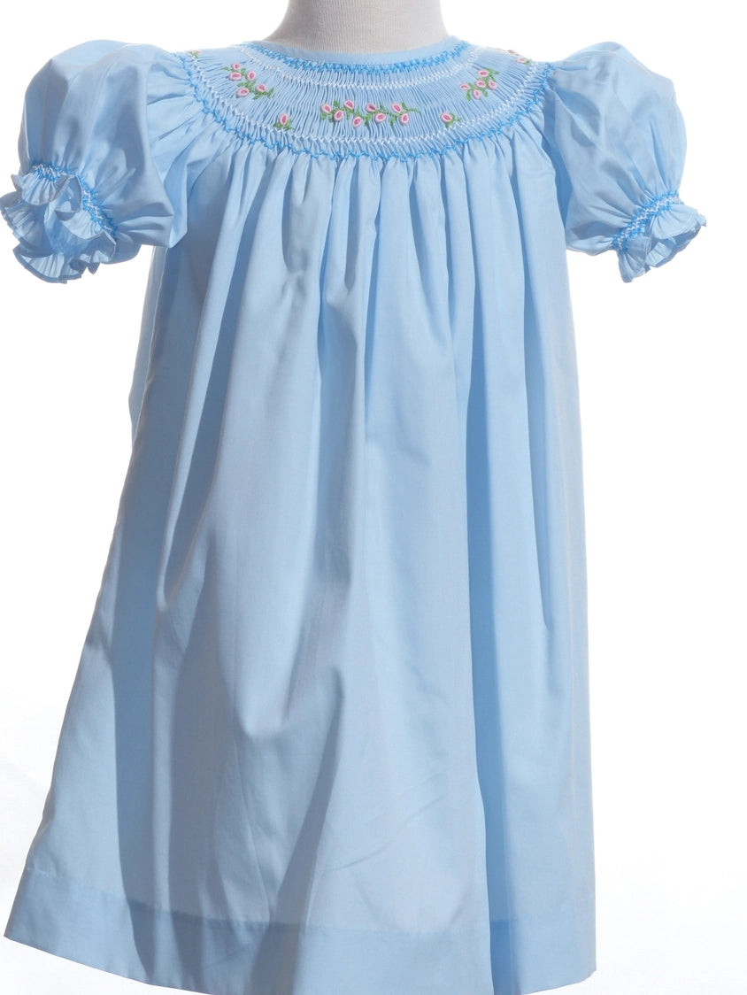 Light blue dress with floral embroidery on a white background