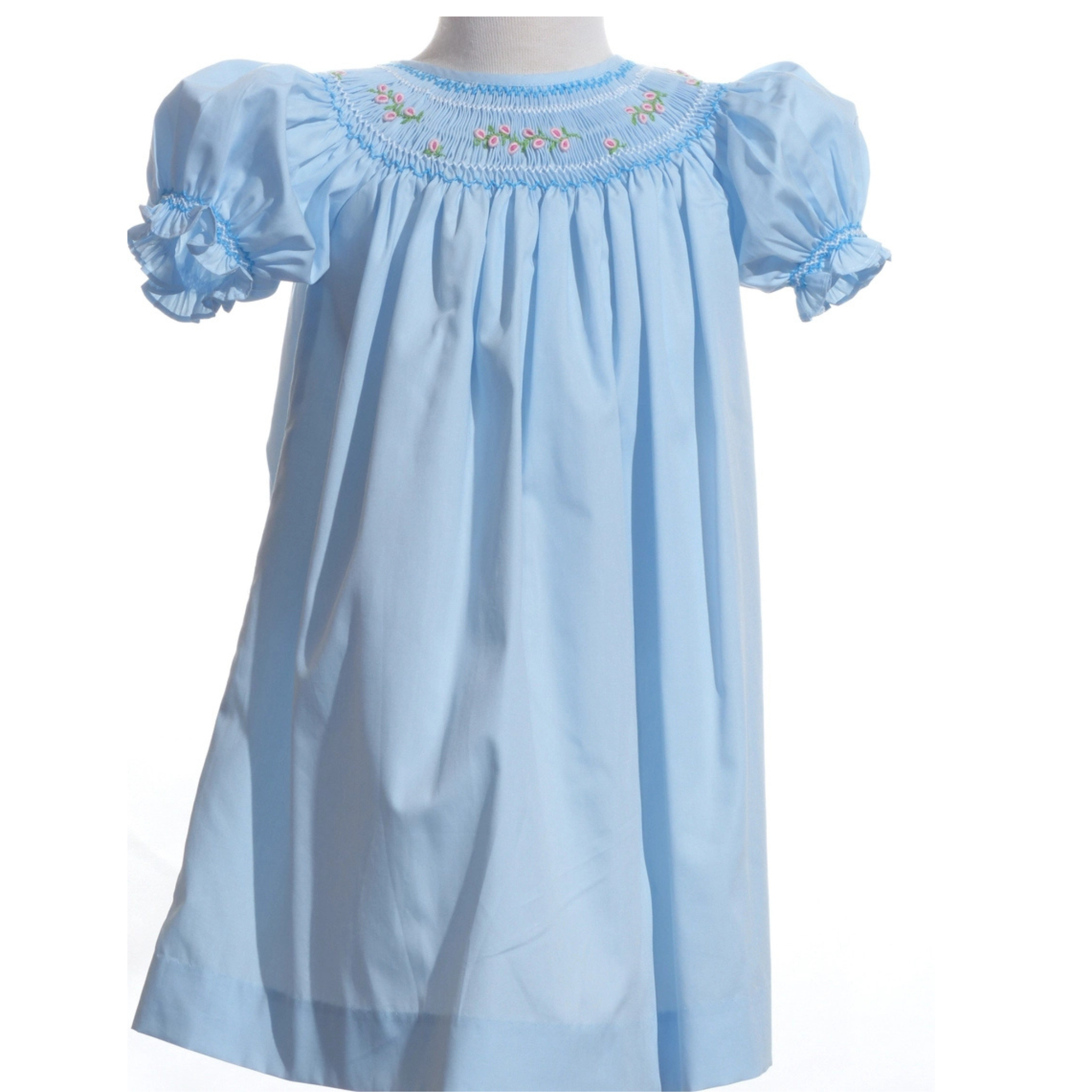 Light blue dress with smocked neckline on a white background