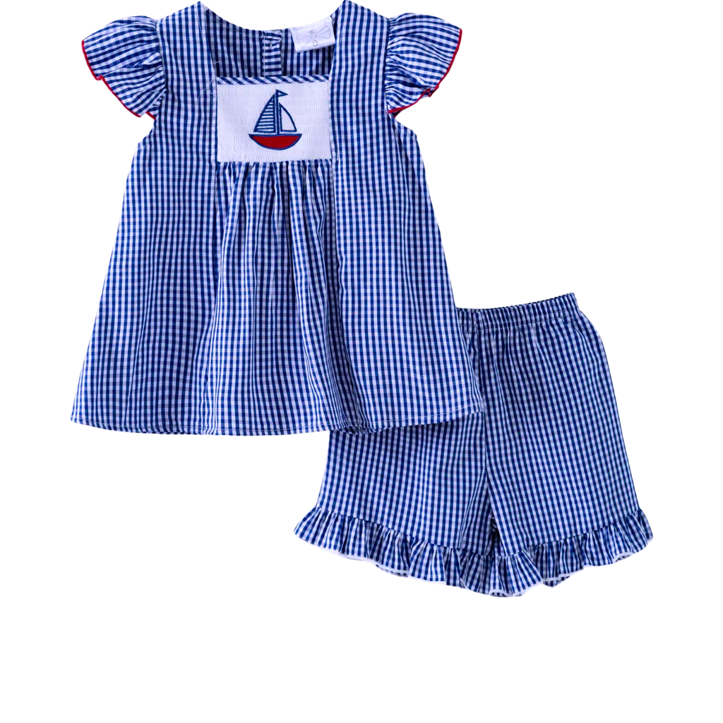Blue checkered top and shorts set with sailboat design on a white background