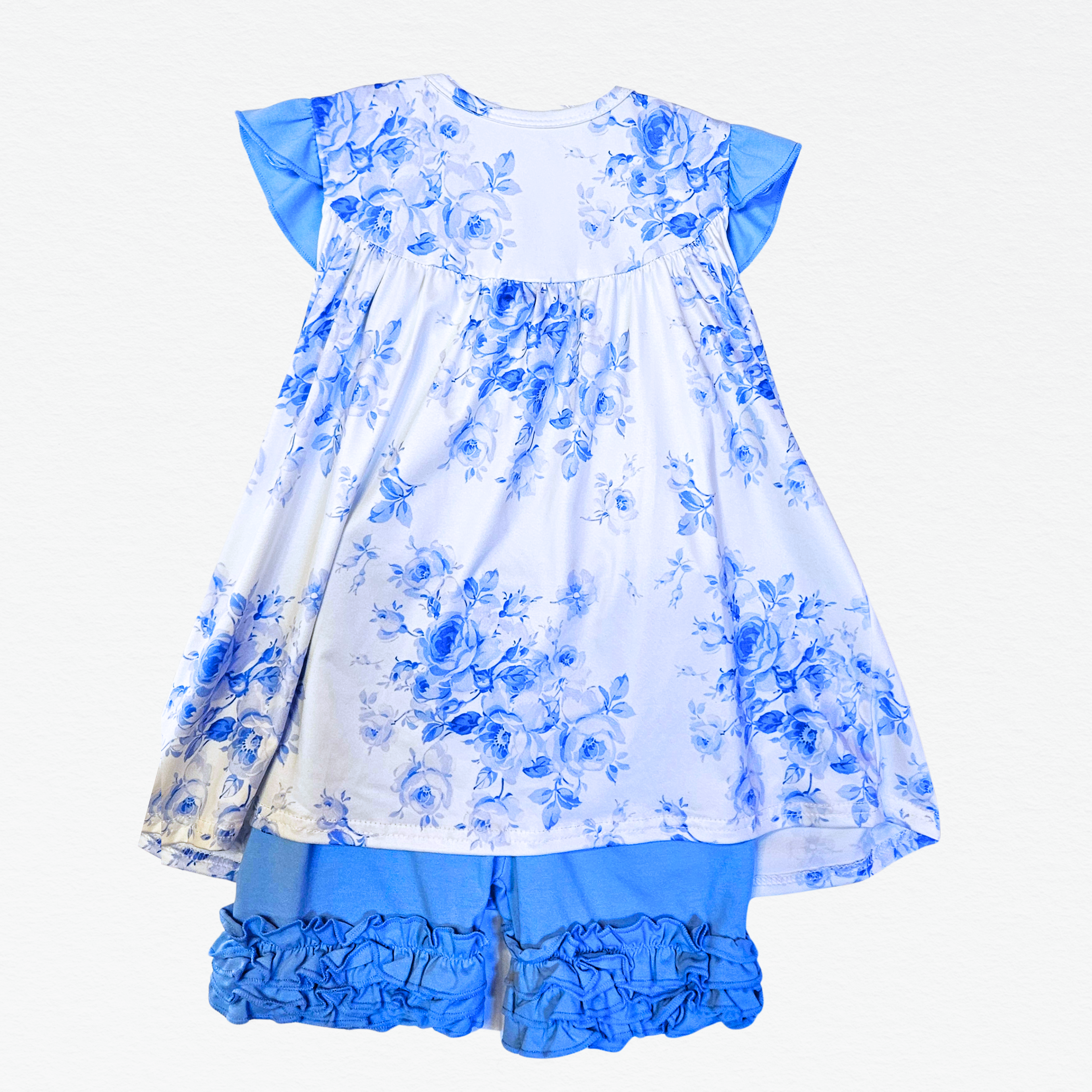 Blue floral dress with ruffled shorts on a white background
