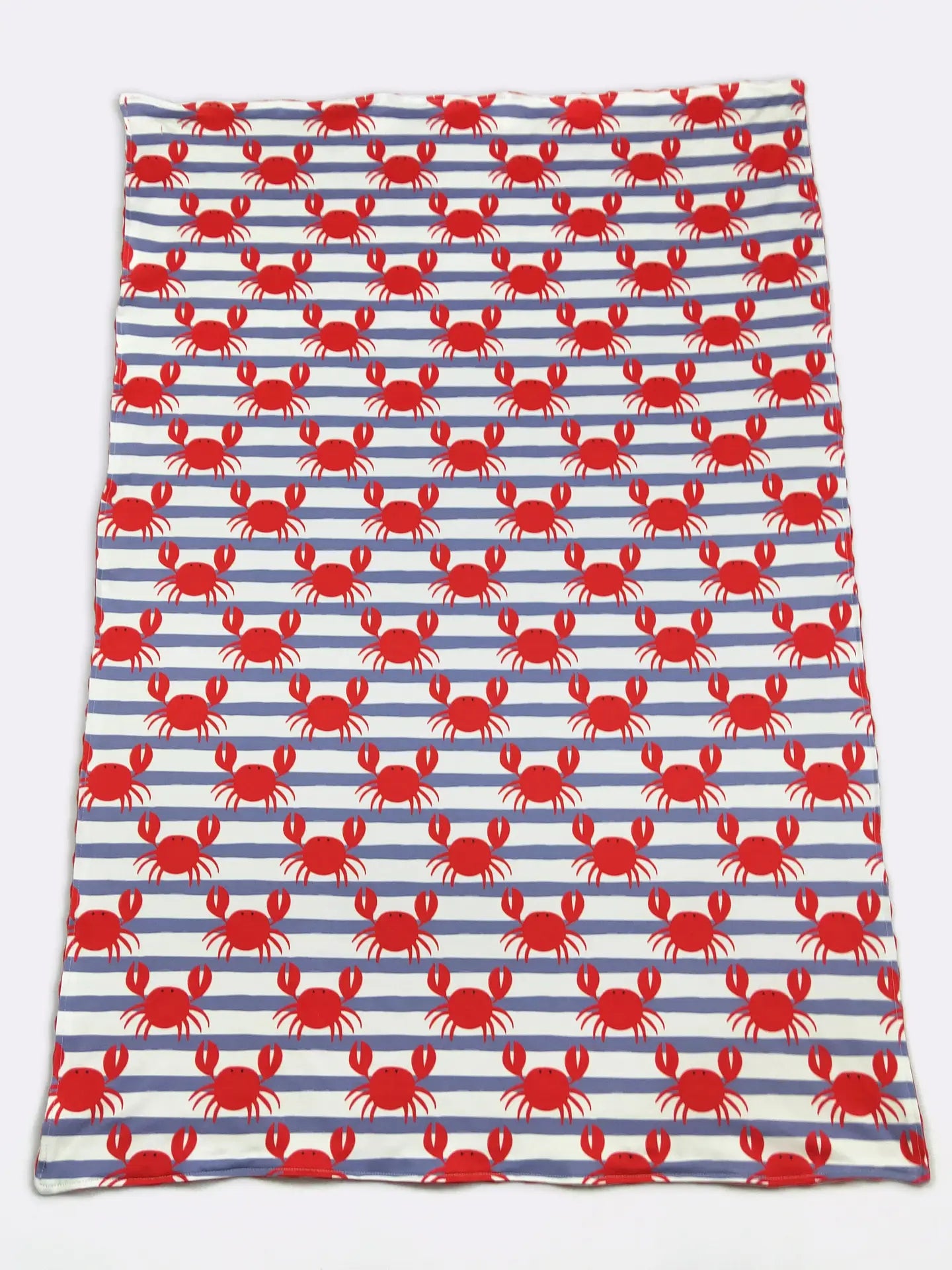 Fabric with red crab pattern on blue and white striped background