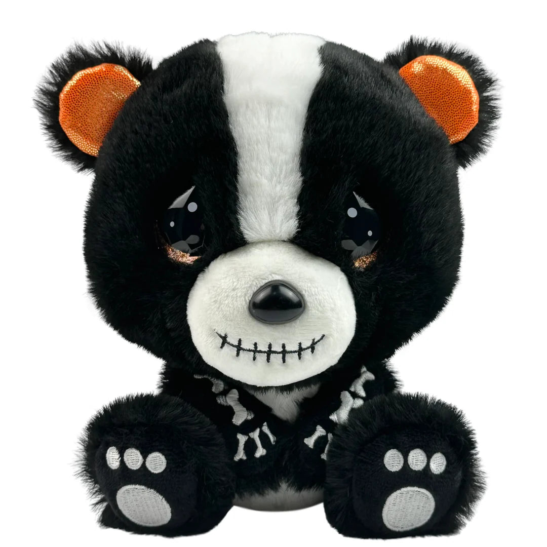 Black and white plush toy resembling a skunk on a white background