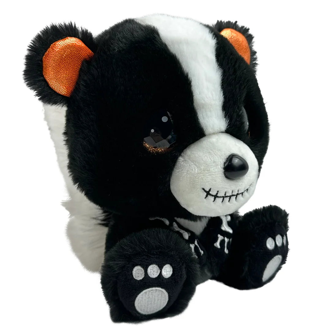 Plush toy resembling a skunk with black, white, and orange colors on a white background