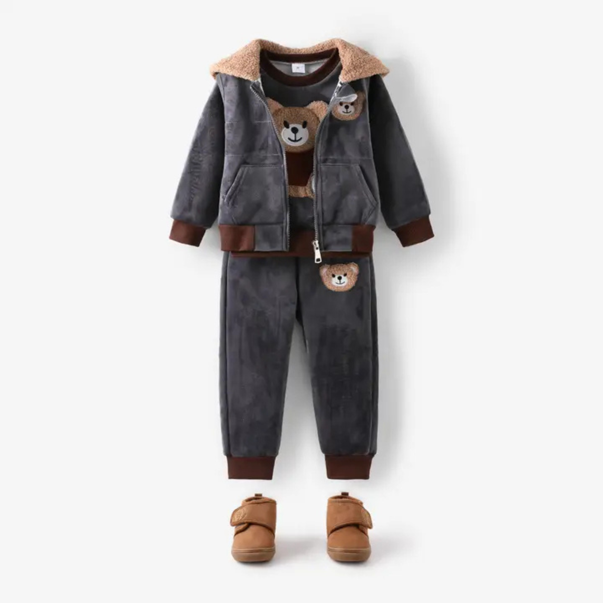 Children's outfit with gray jacket and pants, brown bear face details, and matching shoes on a white background.