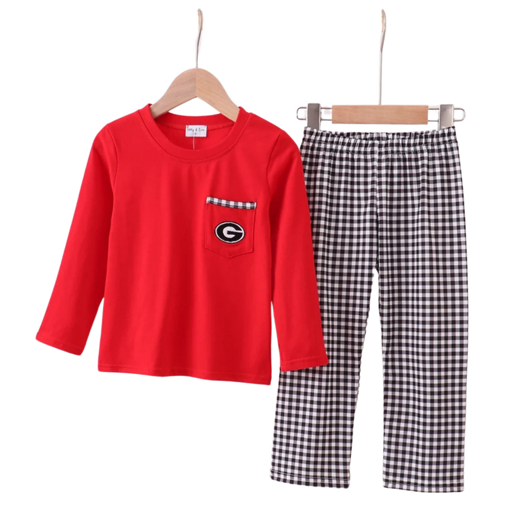 Red long-sleeve shirt with a pocket and checkered pants on hangers against a white background