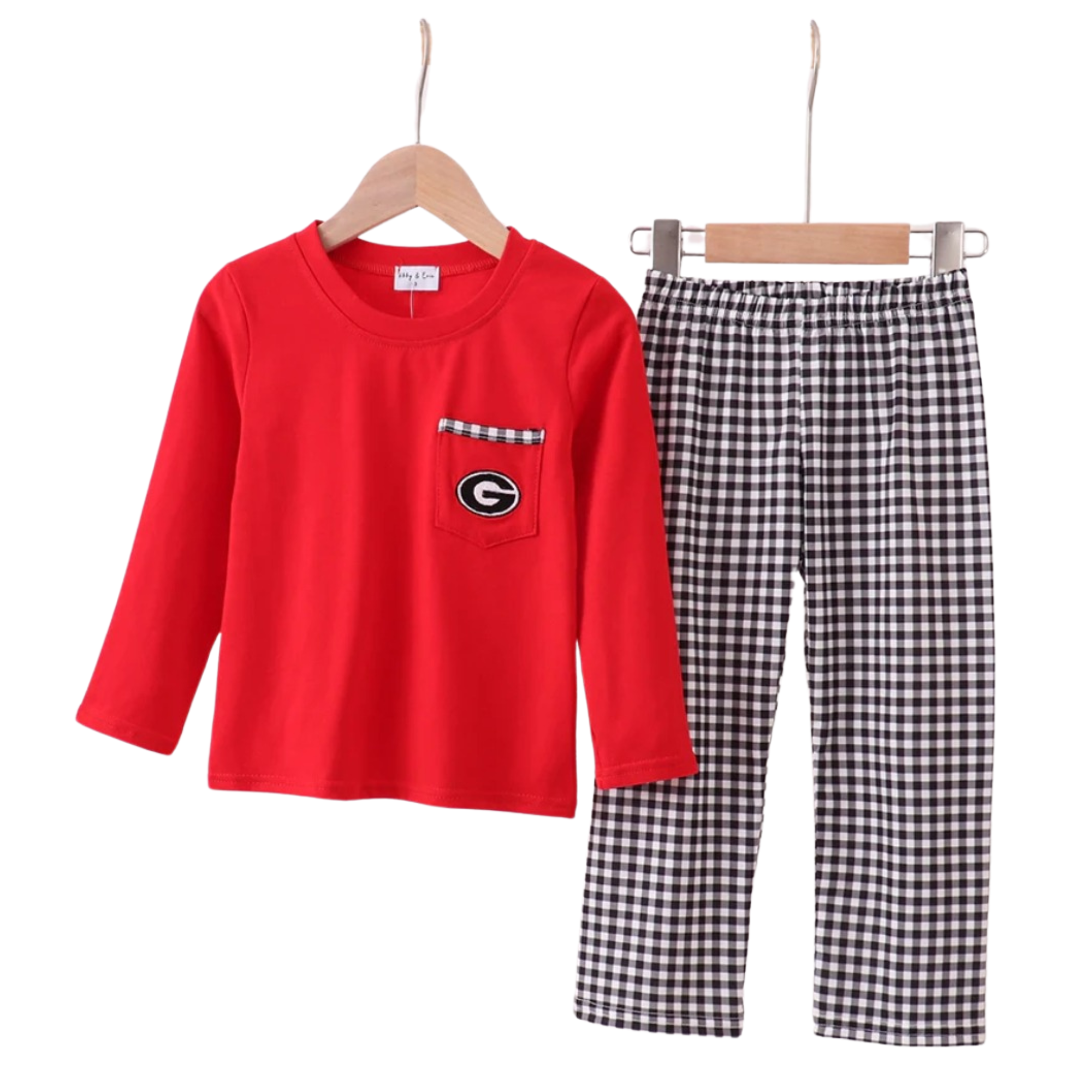 Red long-sleeve shirt with a pocket and checkered pants on hangers against a white background