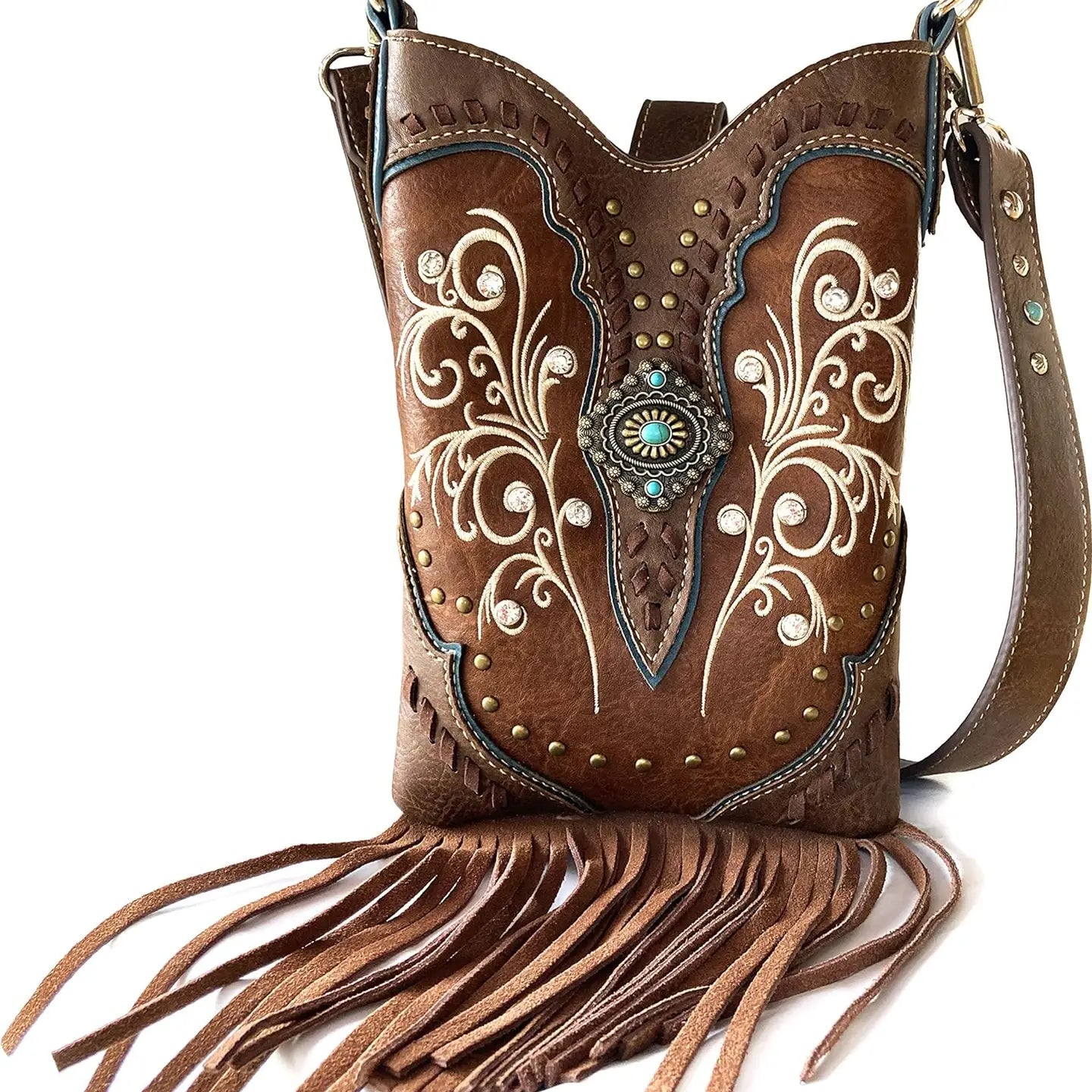 Brown leather handbag with intricate designs and fringes on a white background