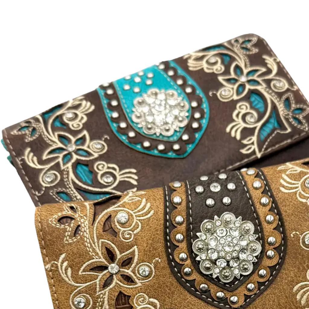 Decorative crossbody wallets with intricate patterns and embellishments on a white background