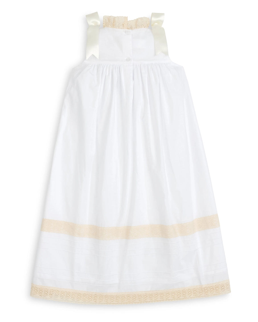 White dress with beige accents on a white background
