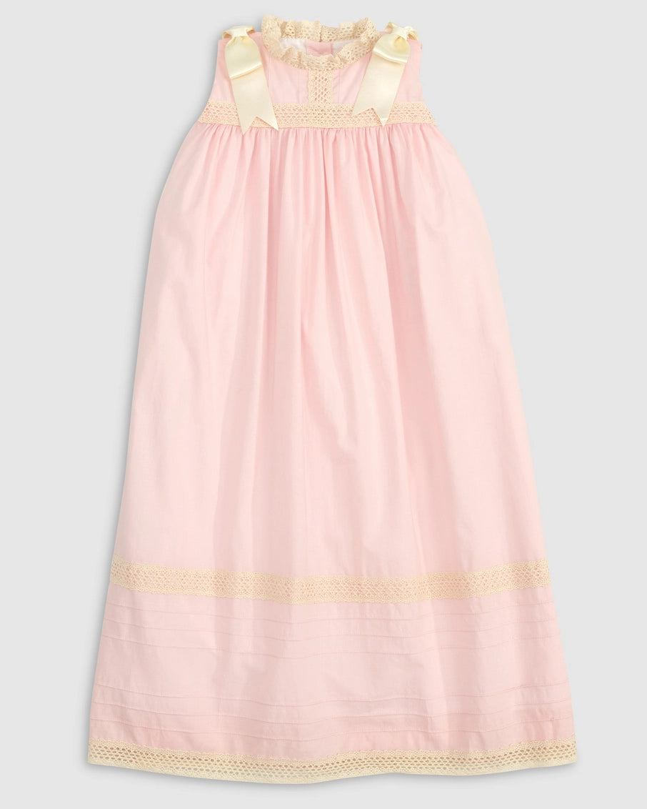 Pink nightgown with yellow accents on a light gray background