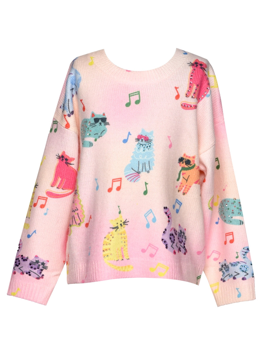 Pink sweater with colorful cat and music note pattern on a white background