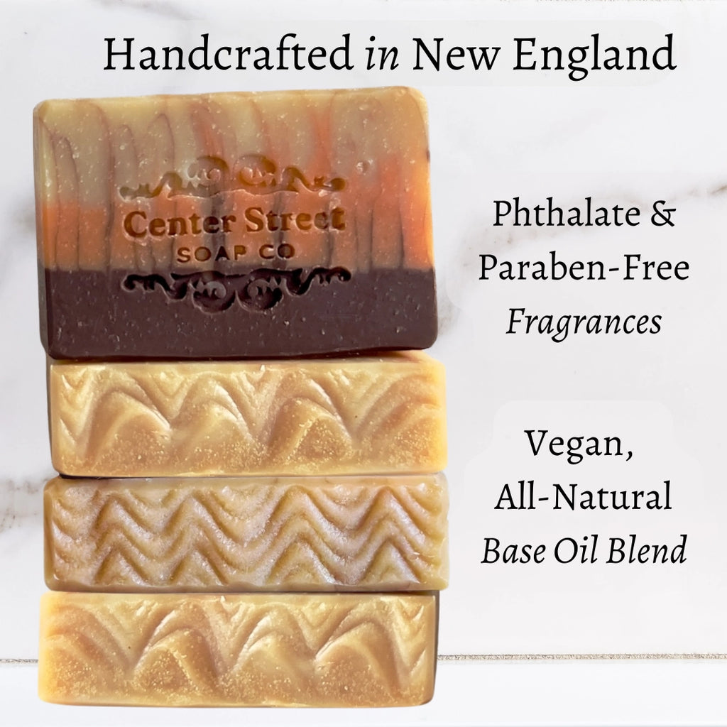 Three bars of soap with 'Center Street Soap Co' branding on a light background, featuring text about product features.