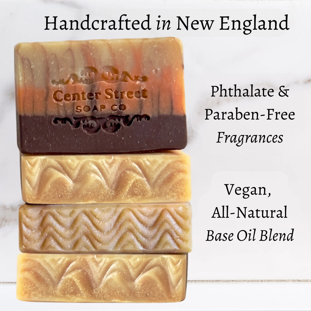 Three bars of soap with 'Center Street Soap Co' branding on a light background, featuring text about product features.