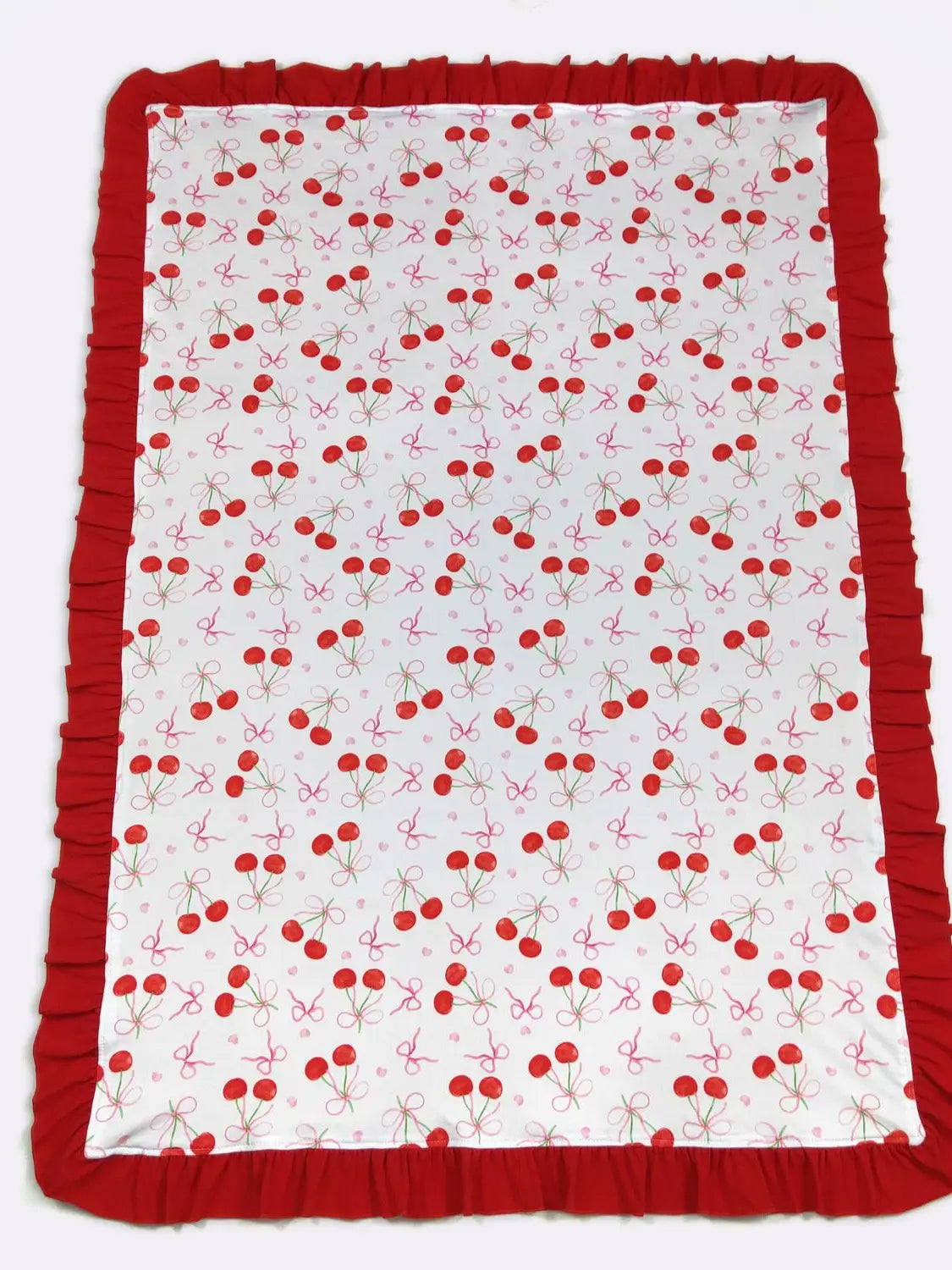 Blanket with red cherry pattern on a white background