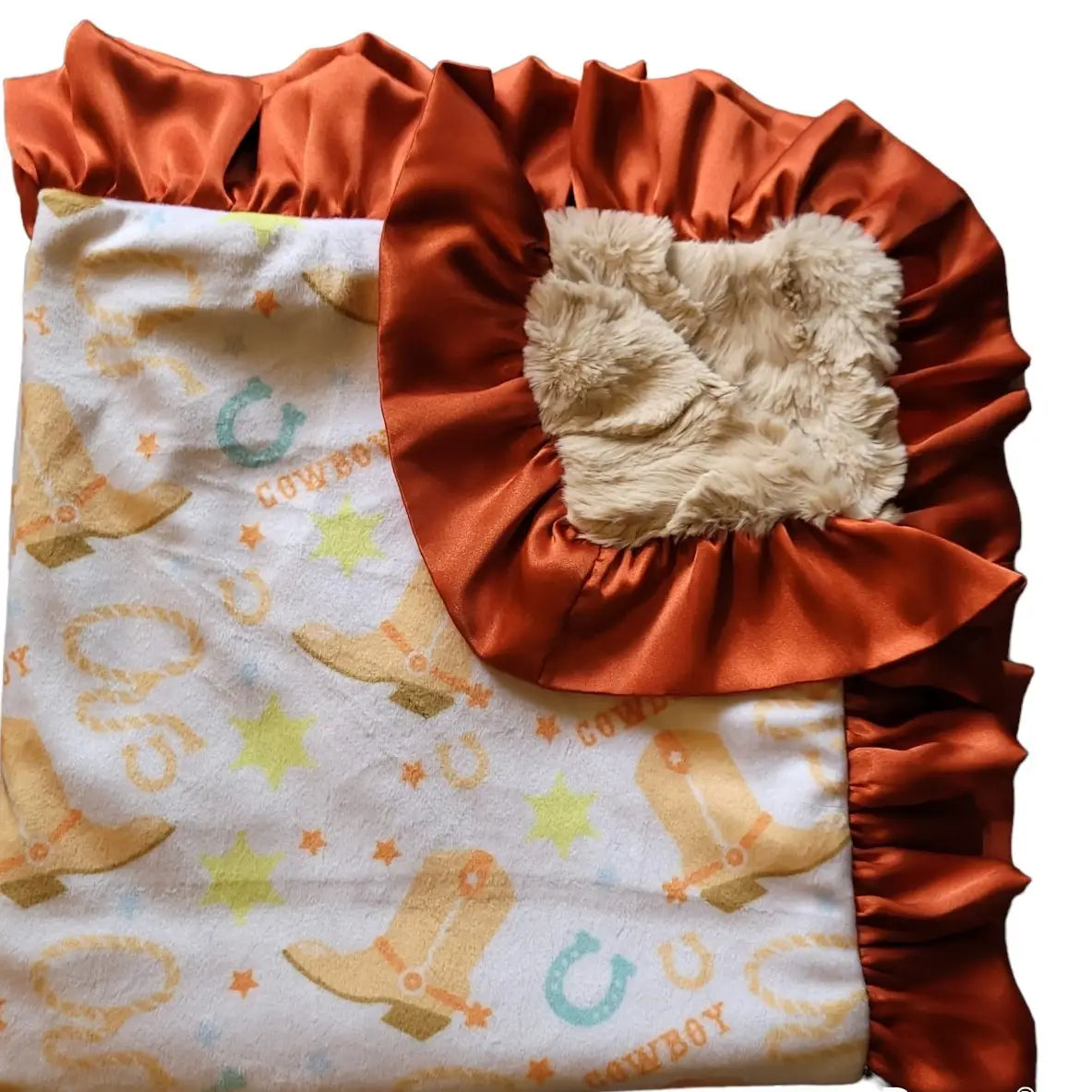 Baby blanket with cowboy boot print and ruffled edge on a white background