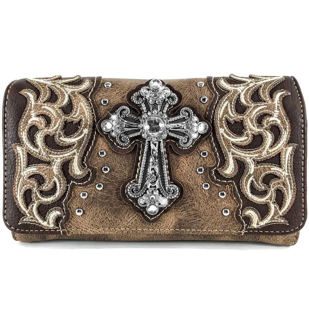 Brown wallet clutch with decorative cross and intricate patterns on a white background