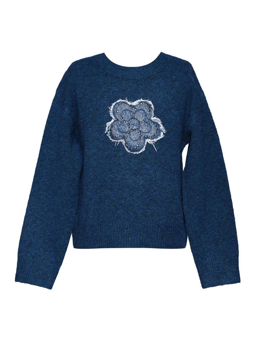 Blue sweater with a white floral design on a white background