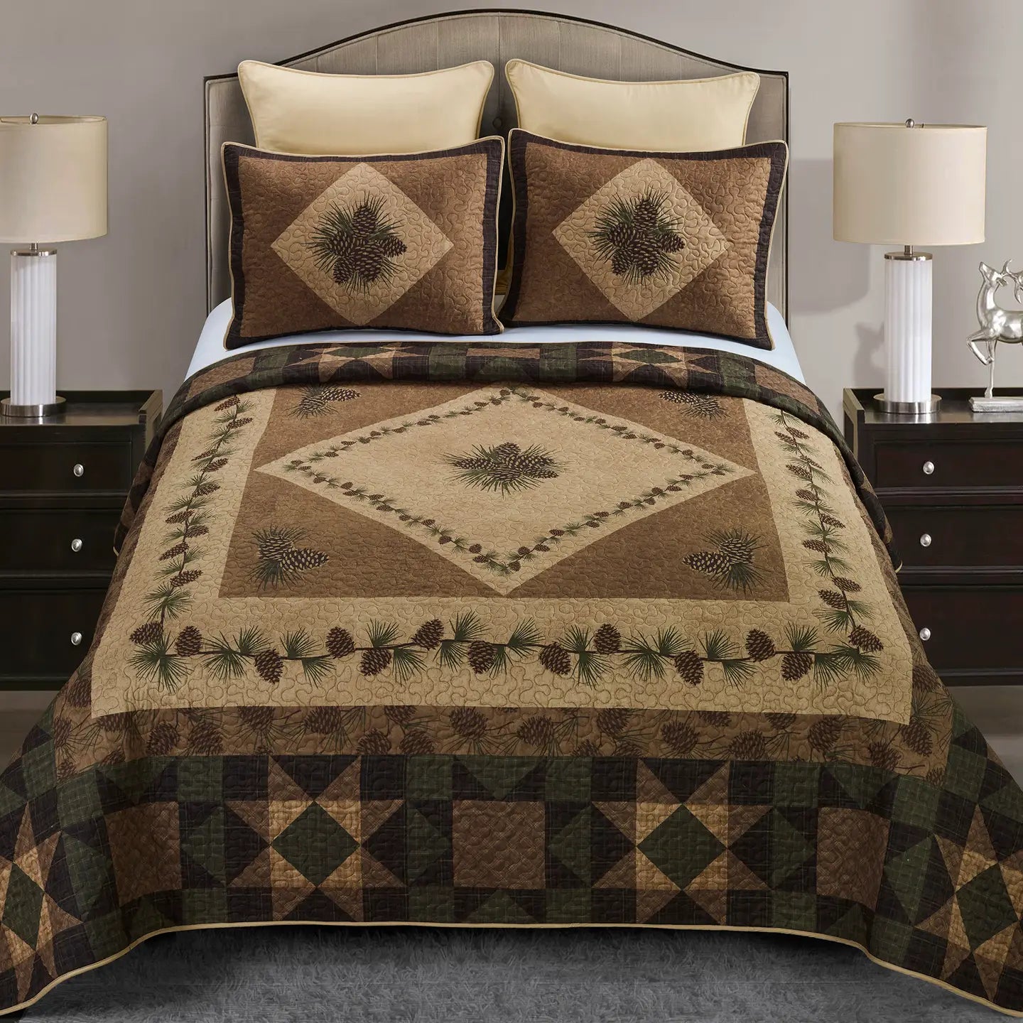 Bed with a patterned quilt and matching pillows in a bedroom setting.