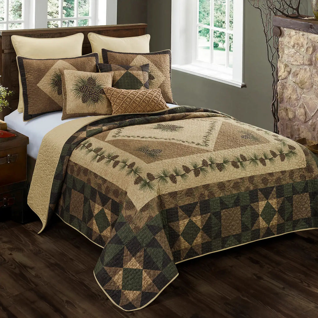 Bed with a quilt and pillows featuring nature-themed patterns in a bedroom setting.