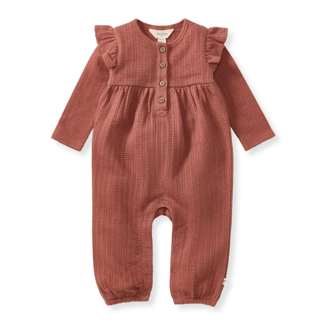 Red-brown baby romper with ruffled sleeves on a white background