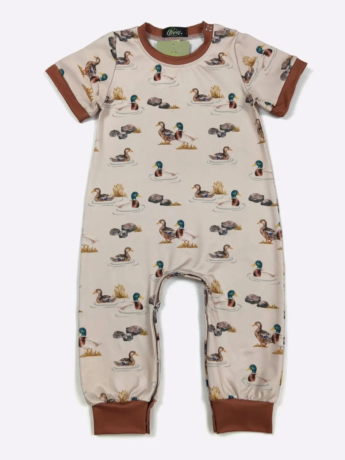 Children's onesie with duck pattern on a beige background