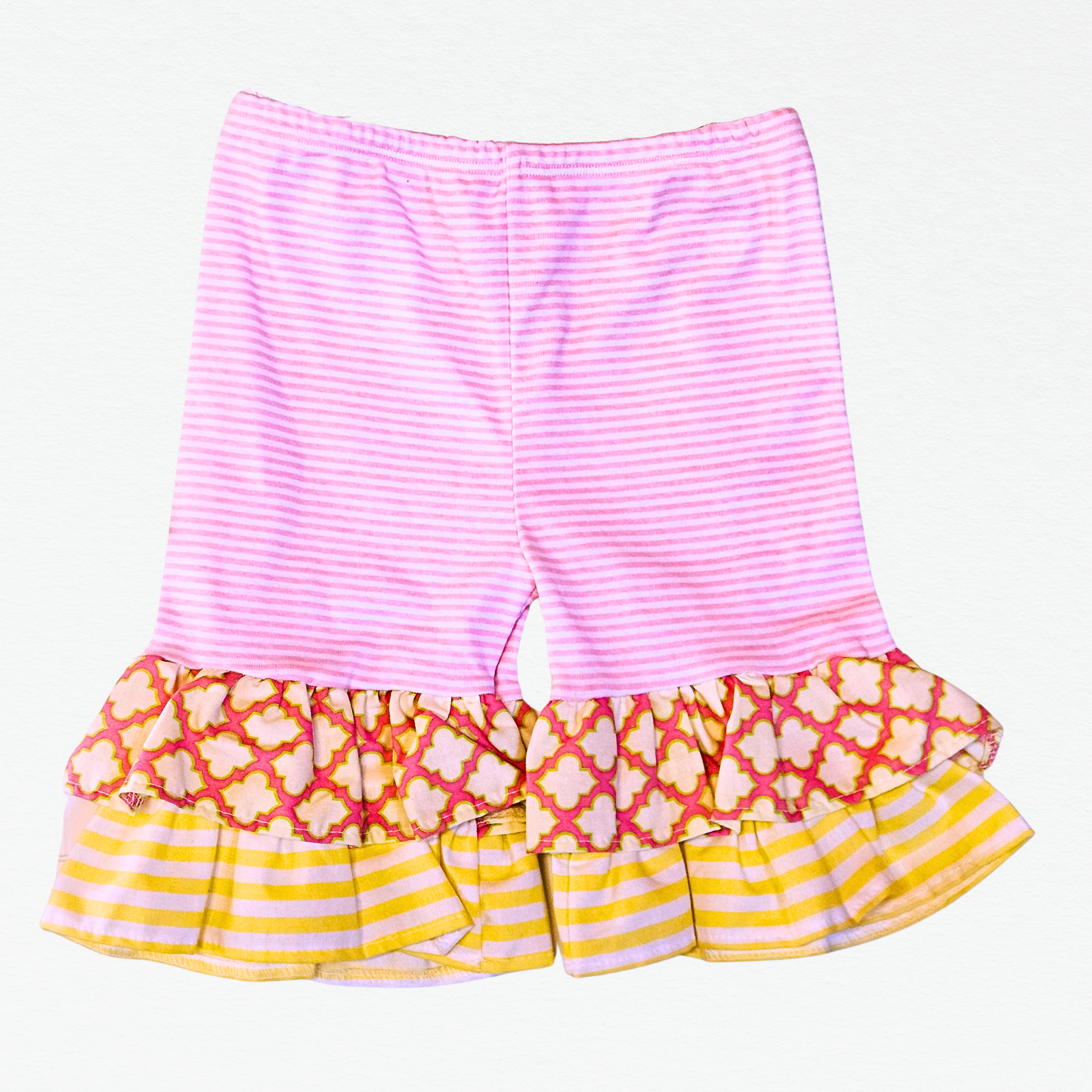 Colorful shorts with ruffled bottom on a white background