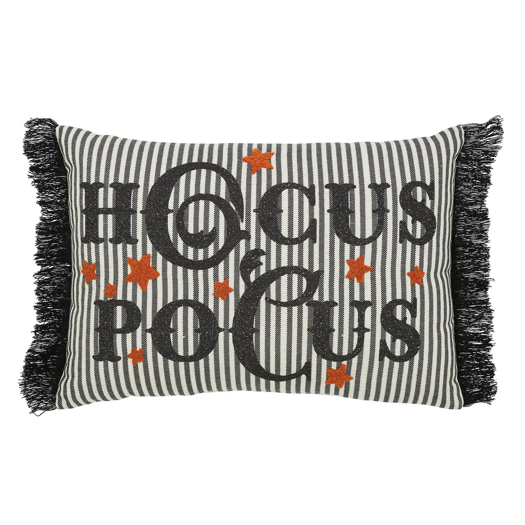 Decorative pillow with 'Hocus Pocus' text and star patterns on a striped background