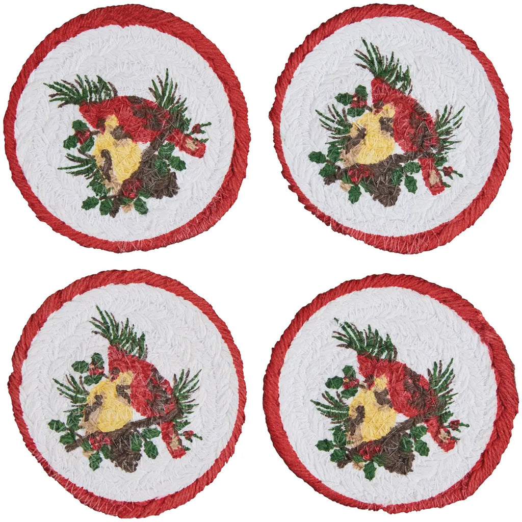 Four round coasters with Christmas-themed design on a white background
