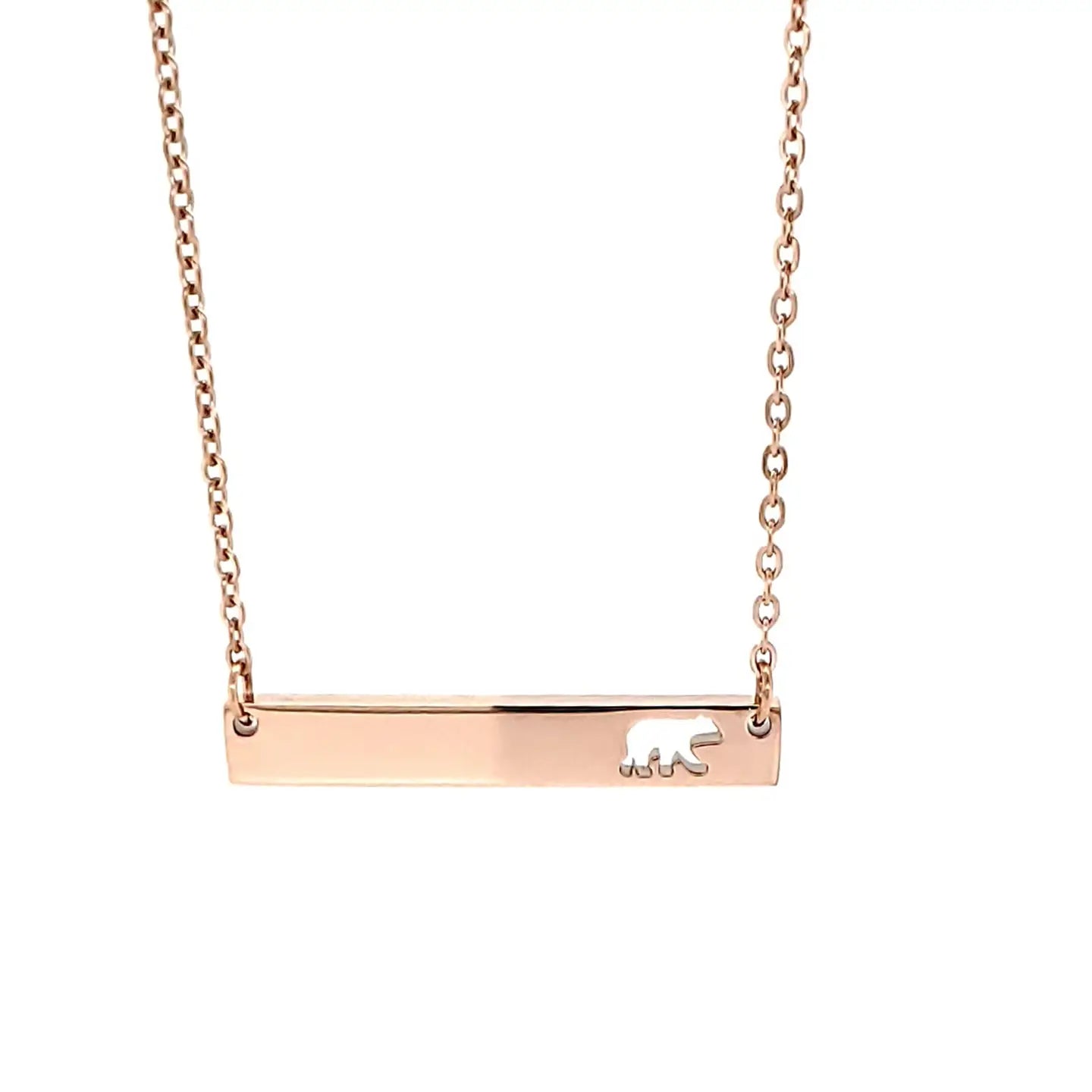 Rose gold necklace with a bar pendant featuring a bear design on a white background