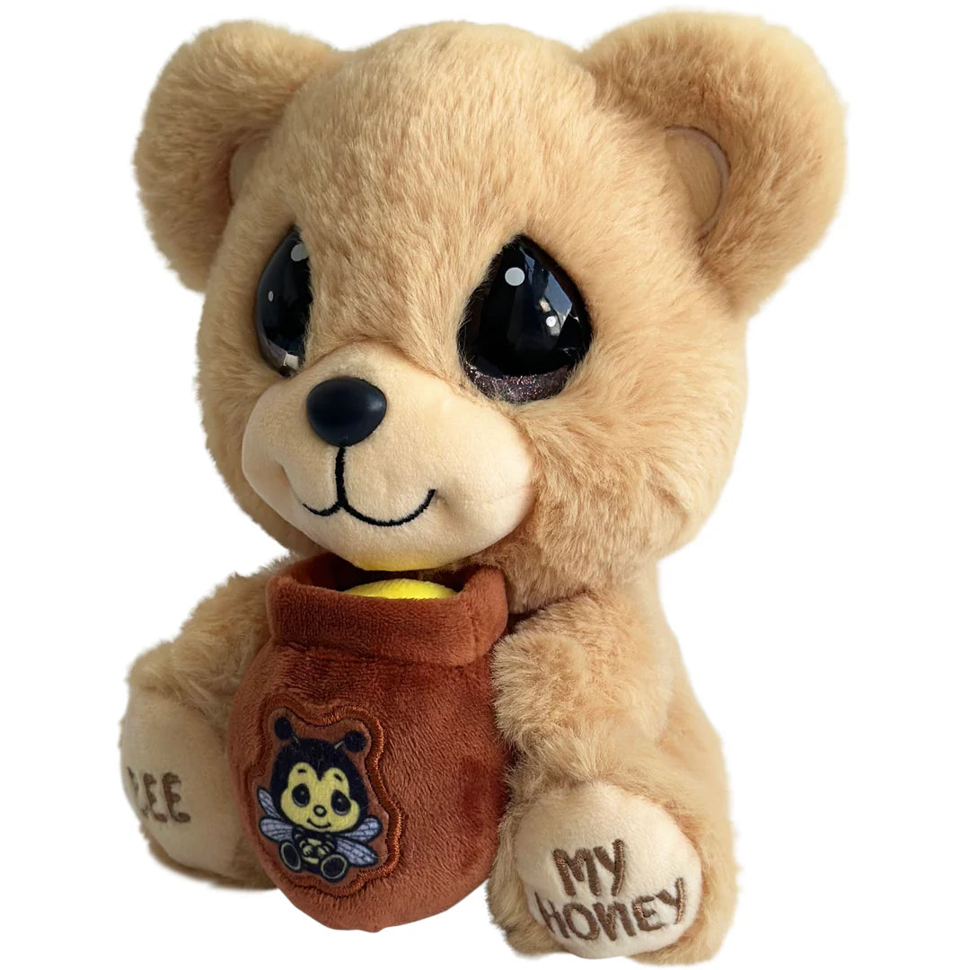 Plush bear holding a honey jar with a bee design on a white background