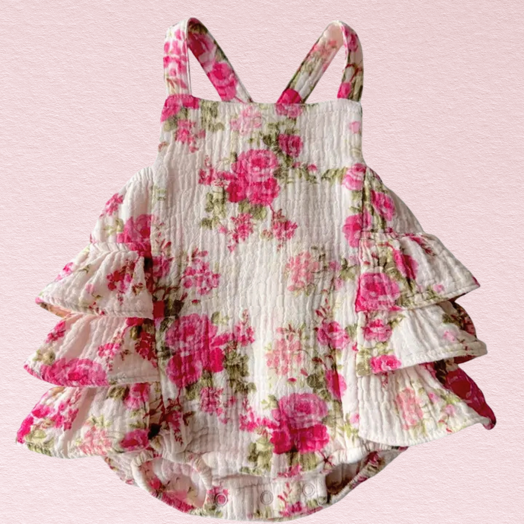 Floral ruffled dress on a pink background