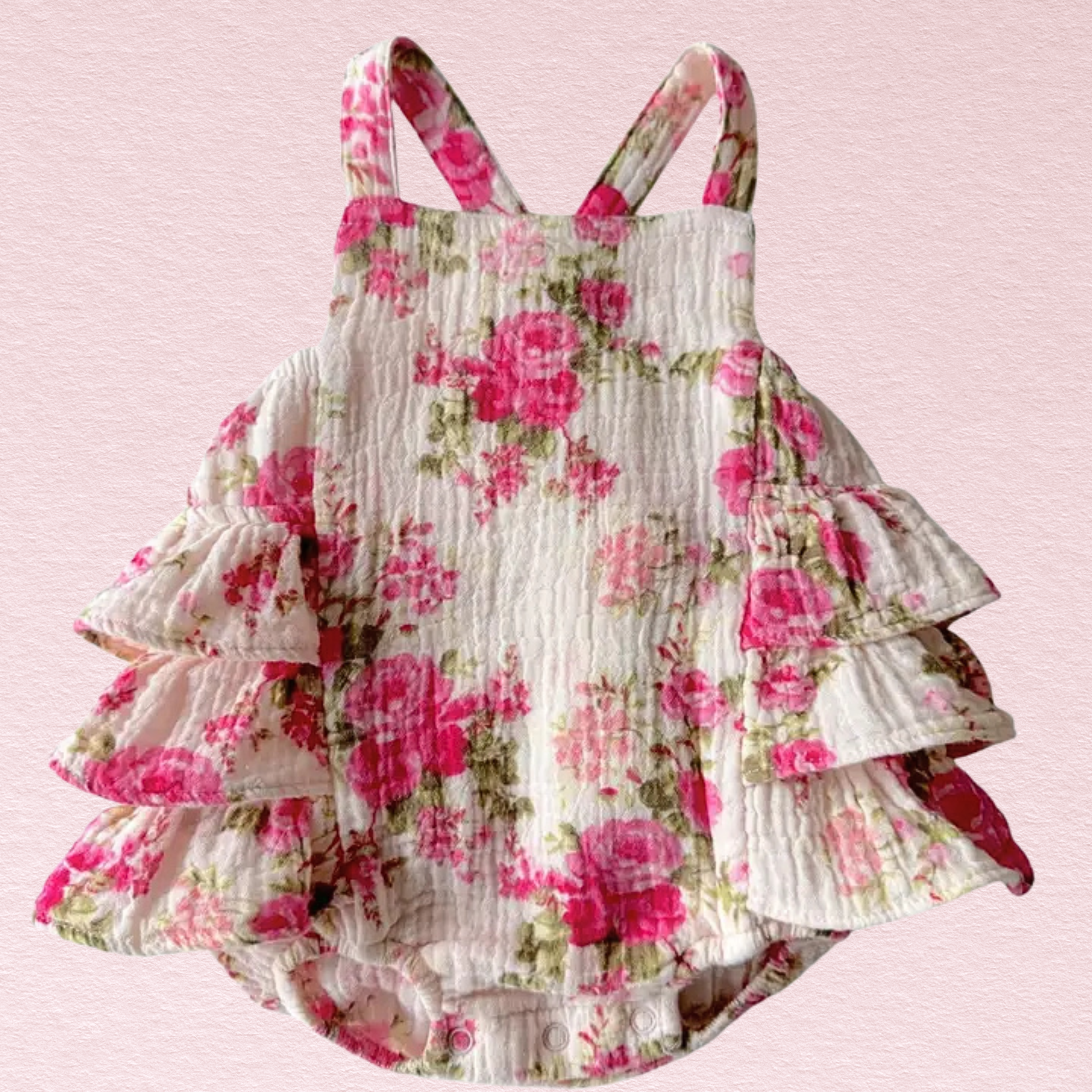 Floral ruffled dress on a pink background