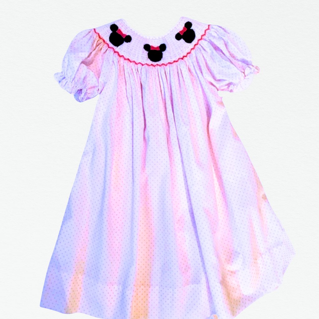 Children's bishop dress with Minnie Mouse ears on a white background