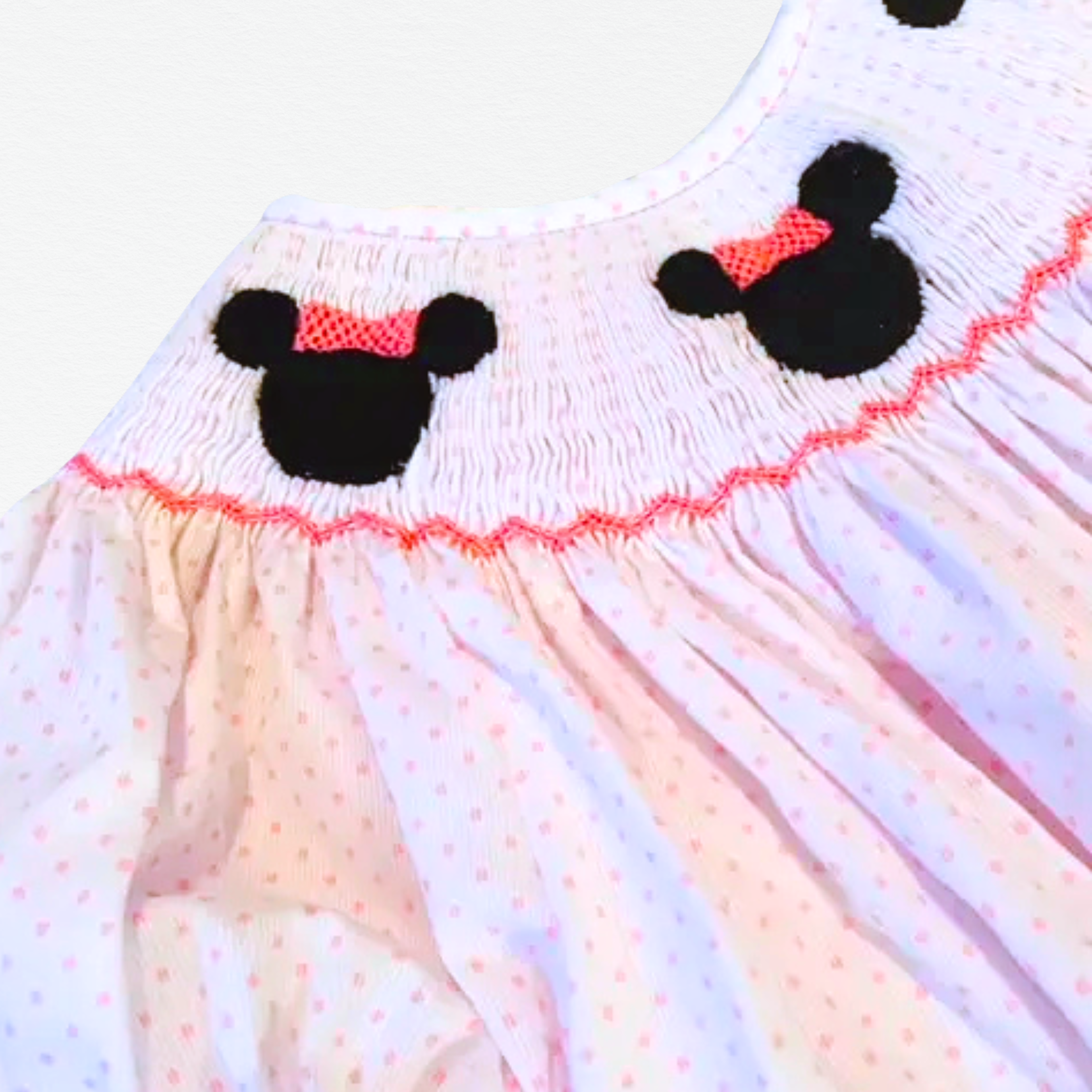Children's bishop dress with Minnie Mouse ears design on a light background