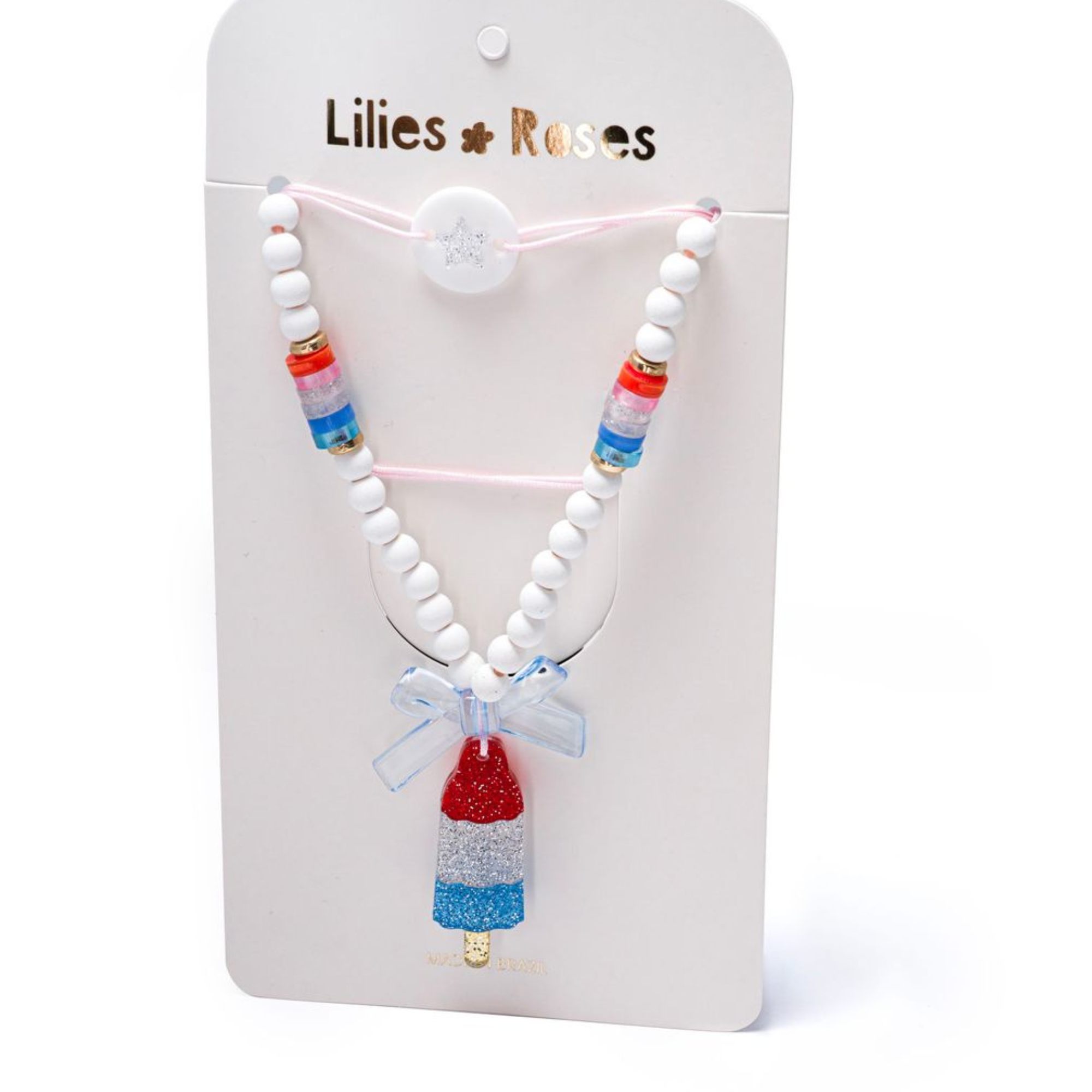 Necklace with colorful beads and a red, white and blue popsicle pendant on a Lilies & Roses card.